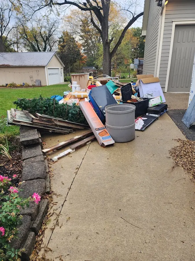 Dumpster being loaded with debris for 3 Yard Dumpster Rental in Fairchild AFB